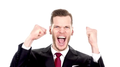 Happy expressions of young man being ecstatic about reaching goals clenching Stock Footage 84010456