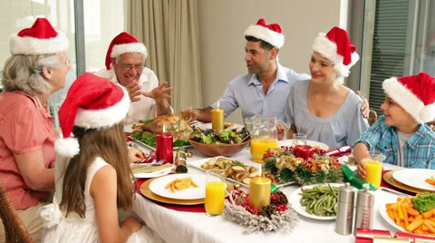 Happy extended family at the christmas dinner table Stock Footage