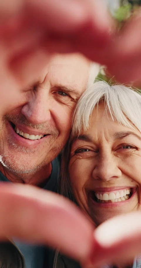 Happy, face and elderly couple with heart hands for romance, love or 動画素材 339152247