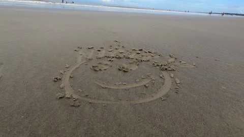 Happy Face in the Sand at Sunset Stock Footage 301732491