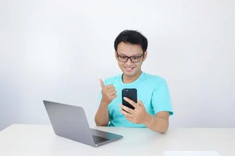 Happy face of Young Asian man in when video call or what on the phone with la Stock Photos