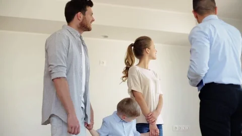 Happy family and realtor at new house or apartment Stock Footage