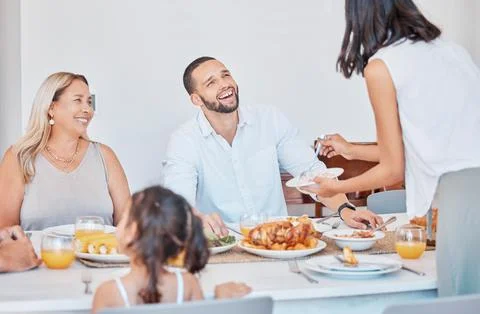 Happy family, bonding and thanksgiving meal at dining table in house, home or Stock Photos
