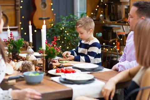 Happy Family Celebrating With Christmas Meal Happy family with Christmas m... Stock Photos