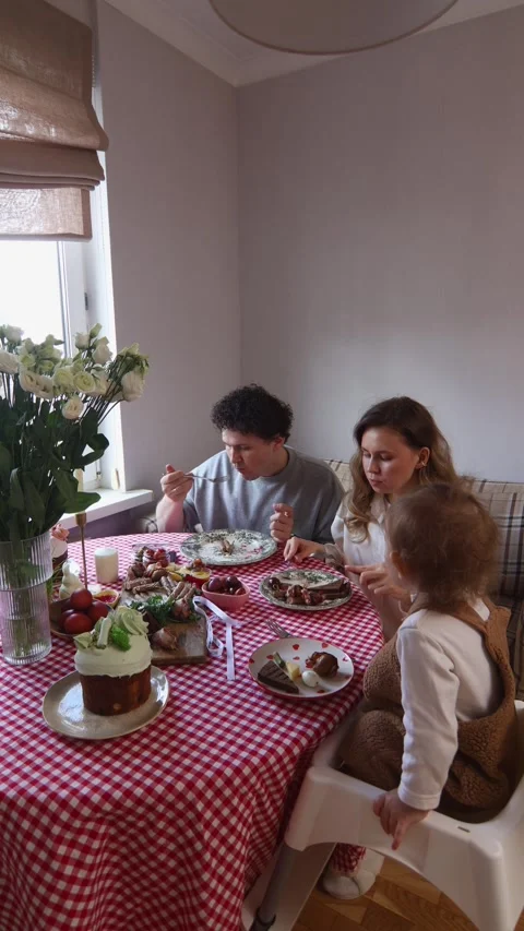 Happy family celebrating Easter at the dinner table. Stock Footage 306152175