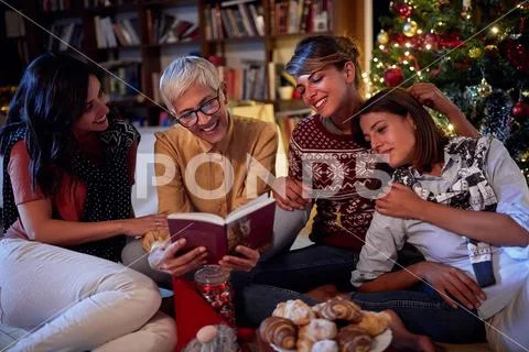 Happy family for Christmas in front of a decorated x-mas tree. mather and her Stock Photos