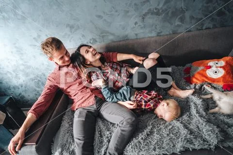 Happy family on the couch Stock Photos