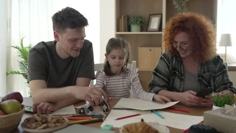 Happy family drawing and playing together at home Stock Footage 333261663
