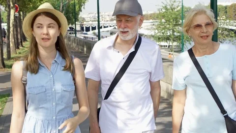 Happy family enjoying vacation. Seniors and their daughter having great time Stock Footage