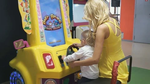 Happy family in an entertainment complex Видео 80289919