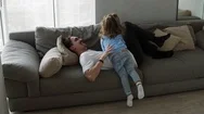 Happy Family Father And Kid Daughter Having Fun Together Laying On Sofa Father Stock Footage