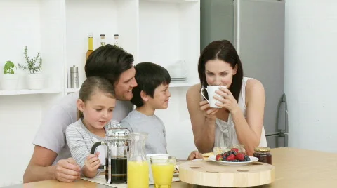 Happy family having breakfast Stock Footage