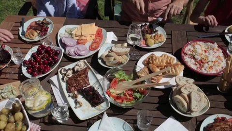 Happy family having dinner or summer garden party Stock Footage