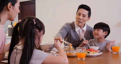 Happy family having dinner together at home. Stock Footage