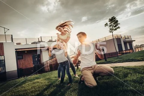 Happy family having fun during summer evening Stock Photos