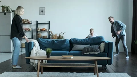 Happy family having fun time at home. A Young Family Father Mother Video stock 157815744