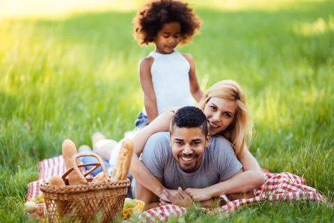 Happy family having fun time on picnic Stock Photos