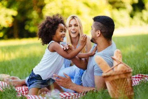 Happy family having fun time on picnic Stock Photos