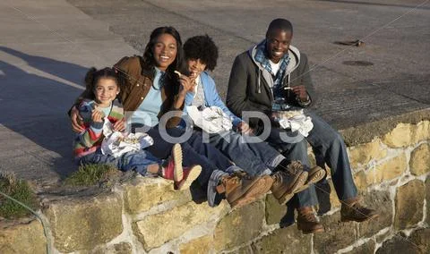 Happy family having picnic Stock Photos