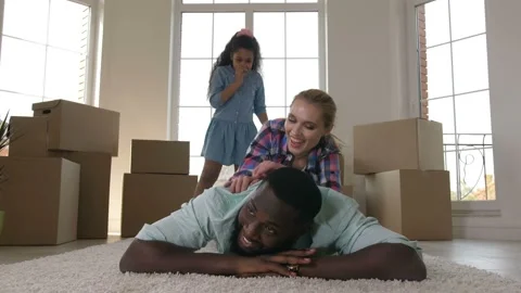 Happy family hugging while making stack on carpet Video stock 107949634