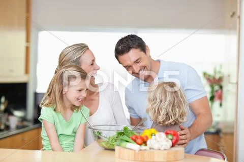 Happy family in the kitchen Stock Photos