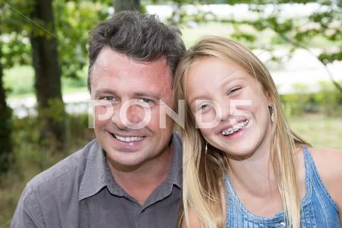 Happy family with one girl and father outdoor Stock Photos