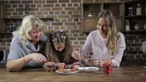 Happy family preparing homemade cookies in kitchen Stock Footage