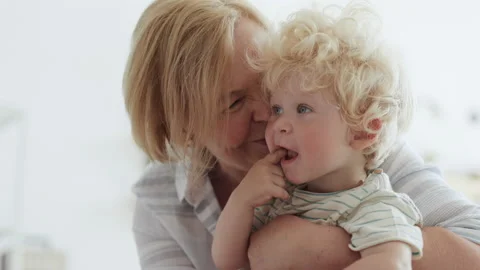 Happy Family Relation of Caucasian Elder Woman and Healthy Curly Kid. Positive B Stock Footage 199479211