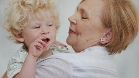 Happy Family Relation of Caucasian Elder Woman and Healthy Curly Baby. Positive Stock Footage 199479212