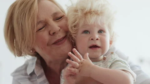 Happy Family Relation of Caucasian Elder Woman and Curly Blond Baby Together. Po Stock Footage 199479220