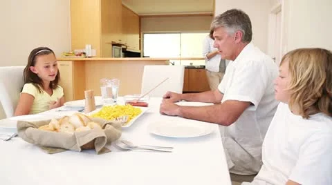 Happy family sitting at the table Stock Footage