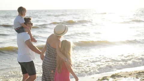 Happy Family Spending Time Together During Summer Vacation on the Seaside. Stock Footage