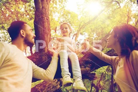 Happy family in summer park having fun Stock Photos