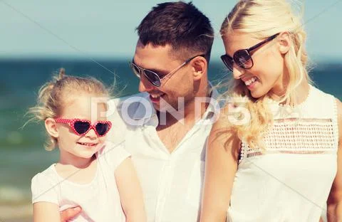 Happy family in sunglasses on summer beach Stock Photos