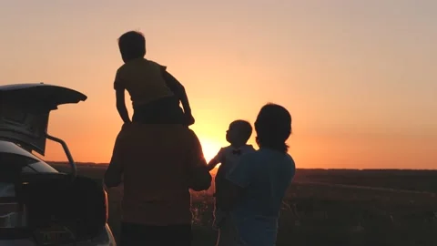 Happy family at sunset travel by car, mom dad and child on tourist trip by Stock Footage