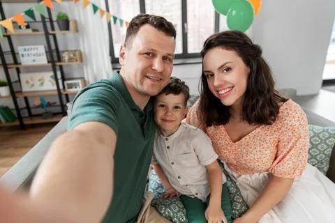 Happy family taking selfie on birthday at home Stock Photos