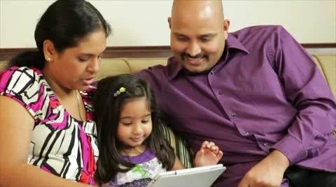Happy family teaching their daughter Stock Footage