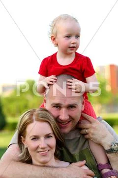 Happy family of three Stock Photos