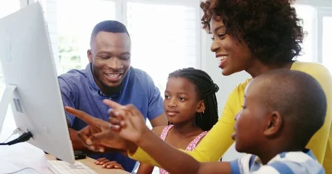 Happy family using desktop computer | Stock Video | Pond5
