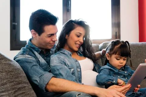 Happy family using tablet. Stock Photos