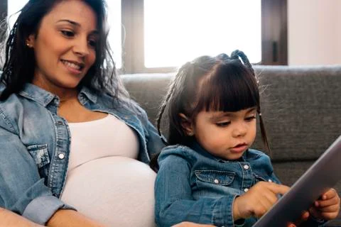 Happy family using tablet. Stock Photos