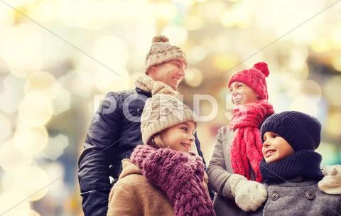 Happy Family In Winter Clothes Outdoors