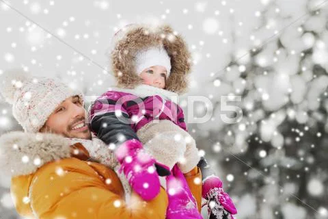 Happy family in winter clothes outdoors Stock Photos