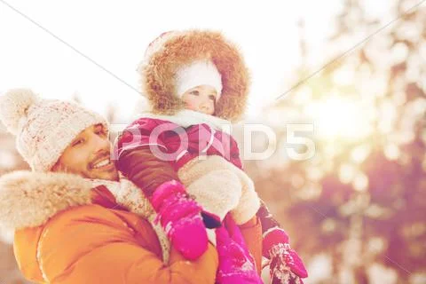 Happy family in winter clothes outdoors Stock Photos