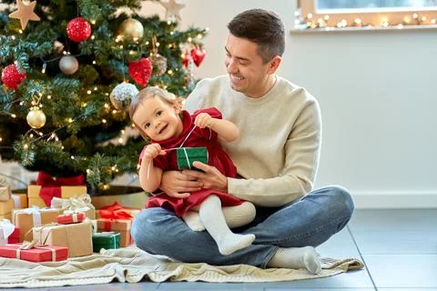 Happy father and baby daughter on christmas Stock Photos