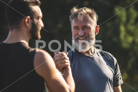 The happy father and a son handshaking outdoor Stock Photos