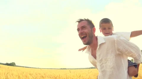 Happy father and son having fun outdoors Stock Footage 59083055