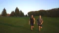 The happy father and a son running on the grass. slow motion 4k or 4k+ Resolution