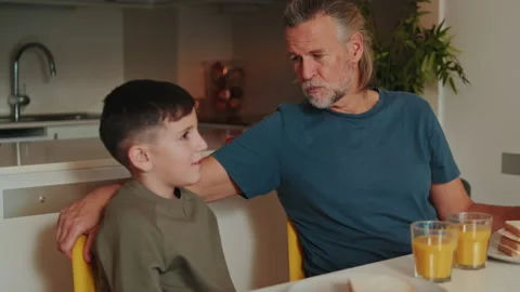 Happy Father And Son Sharing A Meal At Home Stock Footage 339598824