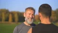 The happy father and a son talking outdoor. slow motion 4k or 4k+ Resolution